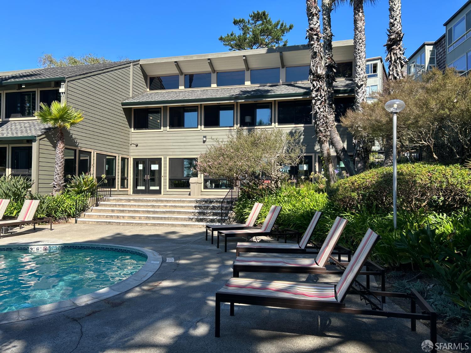 175 Red Rock Way, Unit 101K San Francisco, CA 94131 - Photo 21 of 25 a view of a patio with table and chairs and potted plants