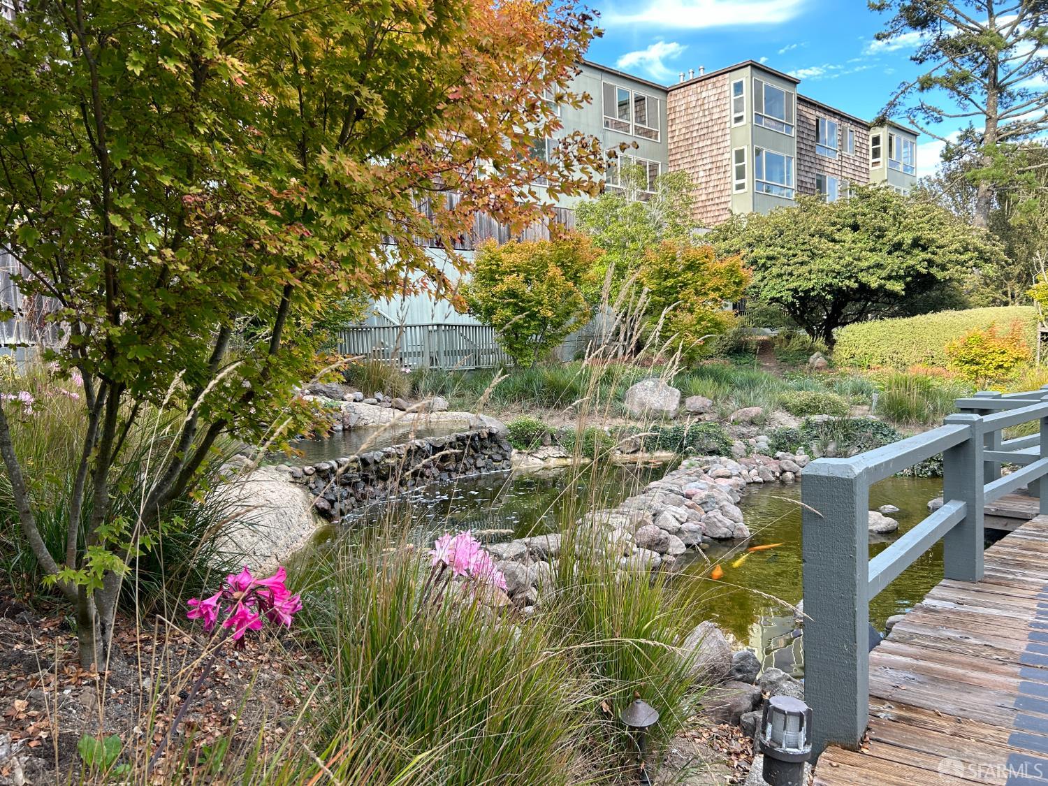 175 Red Rock Way, Unit 101K San Francisco, CA 94131 - Photo 22 of 25 a view of a house with a yard