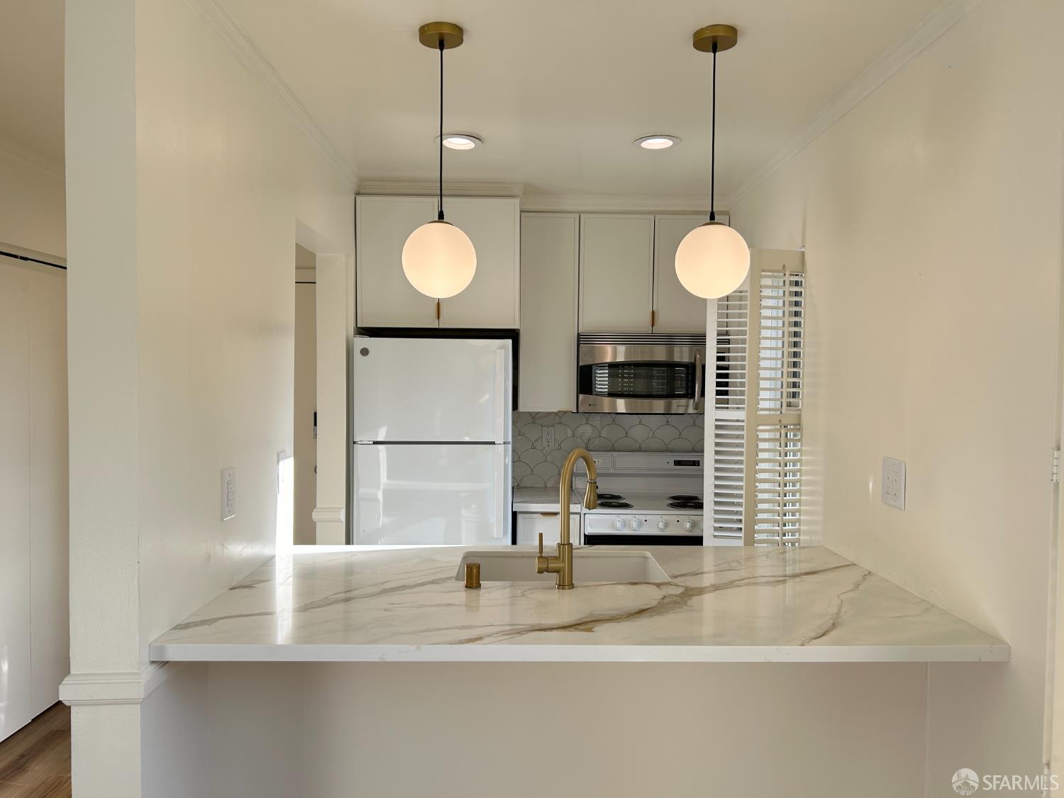 175 Red Rock Way, Unit 101K San Francisco, CA 94131 - Photo 4 of 25 a view of a hallway with a chandelier