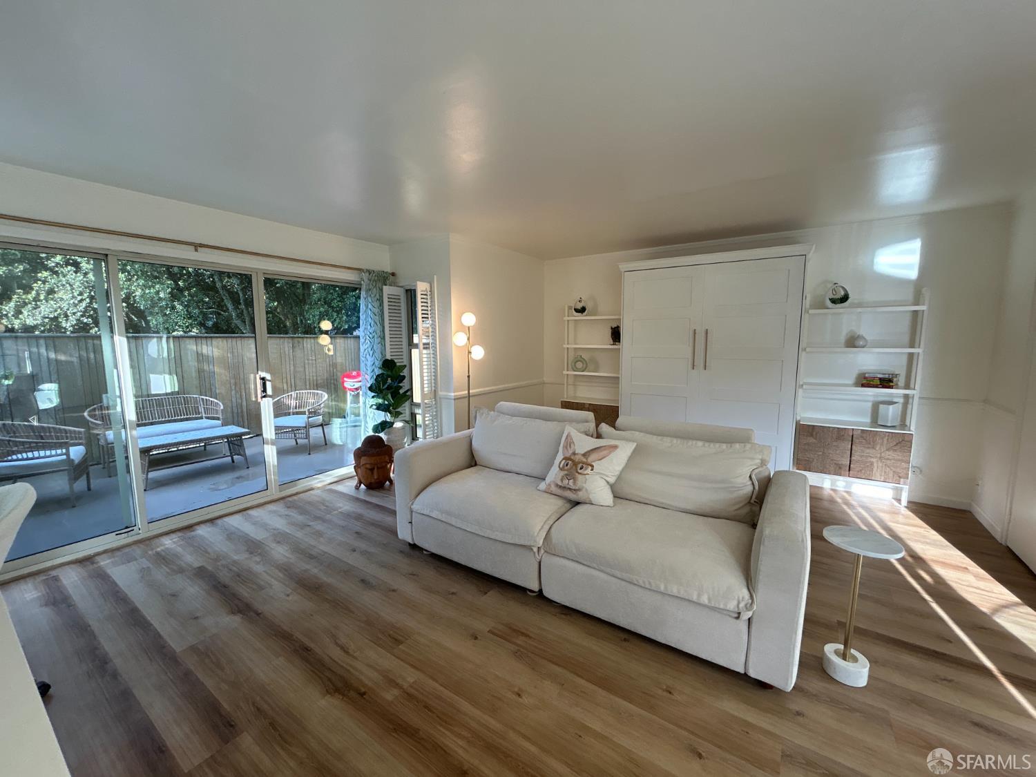 175 Red Rock Way, Unit 101K San Francisco, CA 94131 - Photo 6 of 25 a living room with furniture and a large window