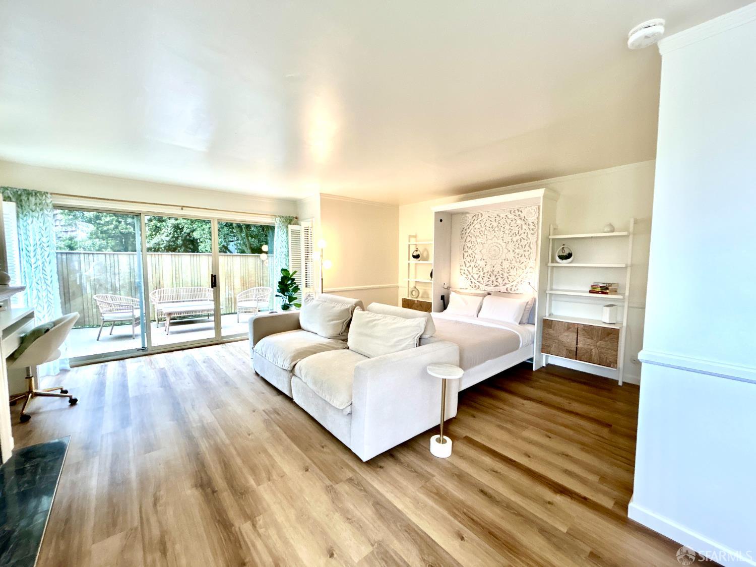 175 Red Rock Way, Unit 101K San Francisco, CA 94131 - Photo 7 of 25 a spacious bedroom with a bed and large windows