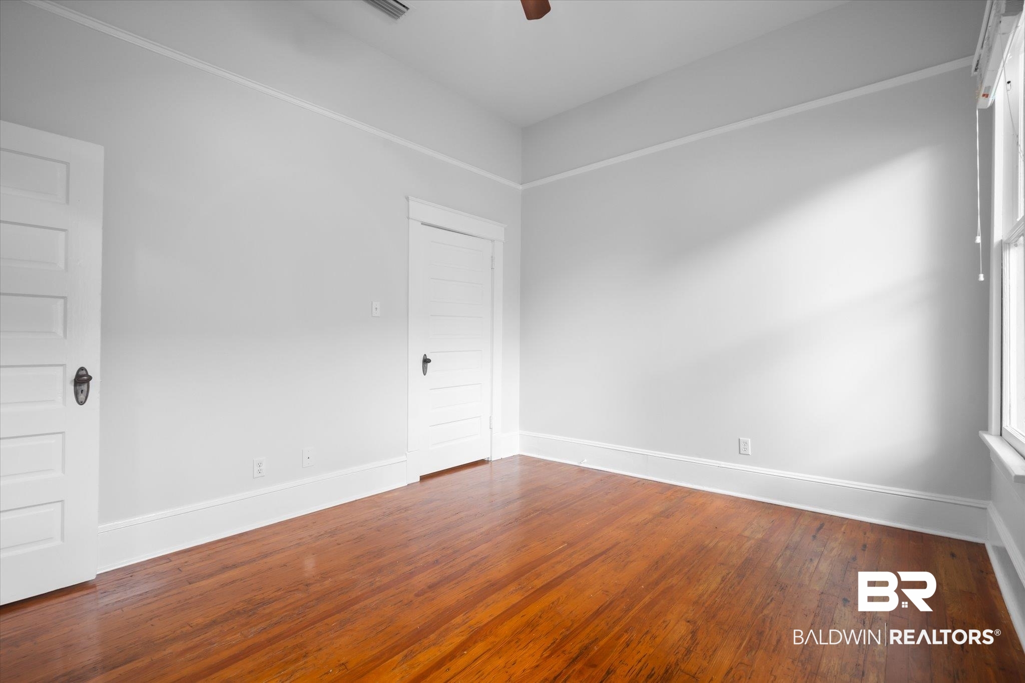14 South Monterey Street Mobile, AL 36604 - Photo 31 of 41 Unfurnished room featuring hardwood / wood-style flooring and ceiling fan