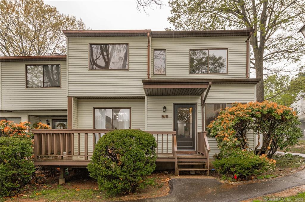 71 Cypress Road, Unit 71 Newington, CT 06111 - Photo 1 of 1 front view of a house with a garden