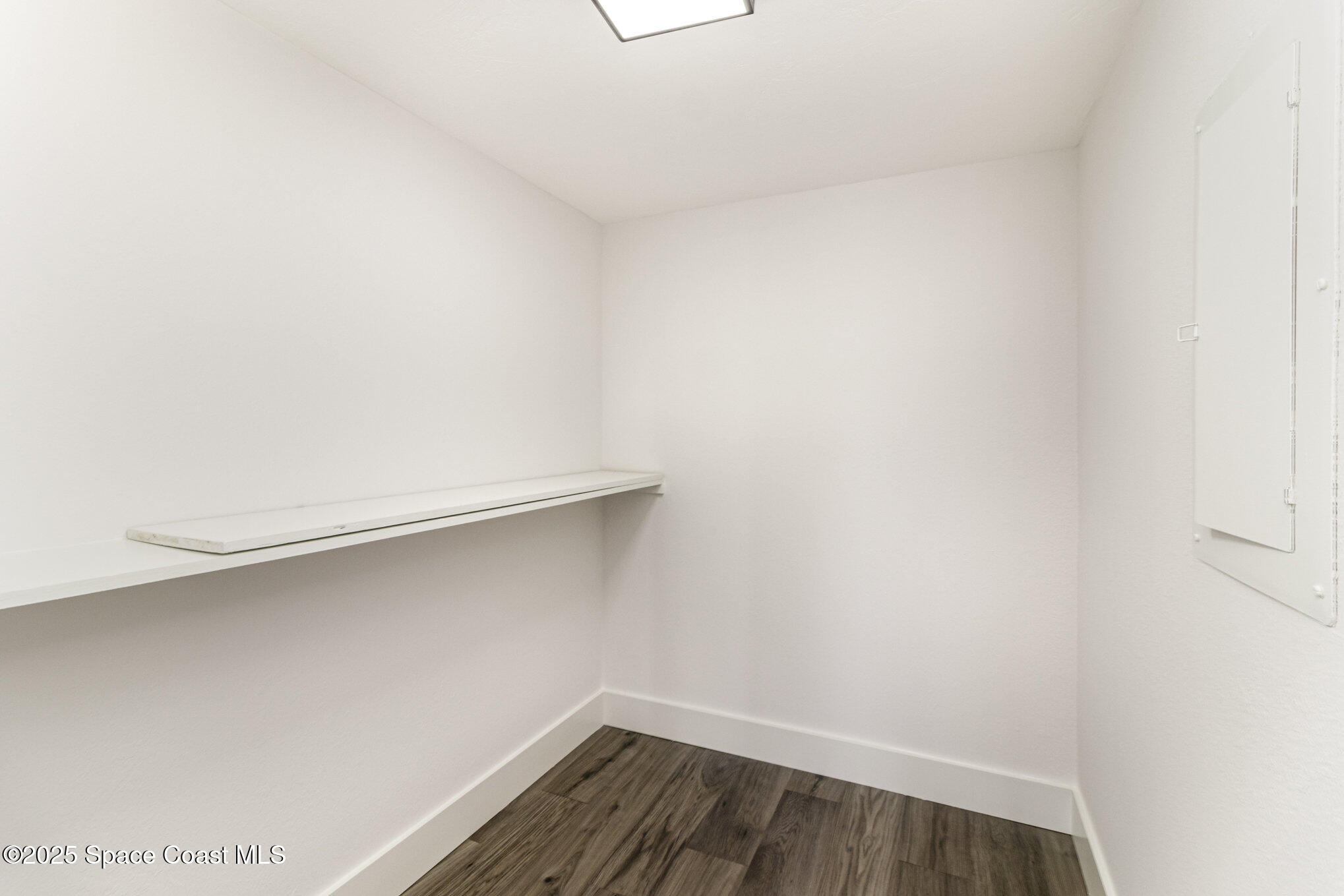 85 South Atlantic Avenue, Unit 306 Cocoa Beach, FL 32931 - Photo 18 of 41 a view of small space with racks on the wall