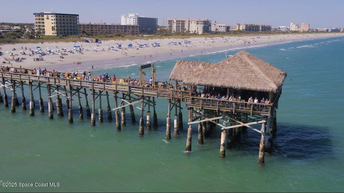 85 South Atlantic Avenue, Unit 306 Cocoa Beach, FL 32931 - Photo 36 of 41 a view of a swimming pool and a terrace