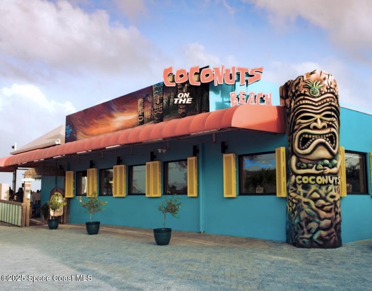 85 South Atlantic Avenue, Unit 306 Cocoa Beach, FL 32931 - Photo 39 of 41 a front view of a building