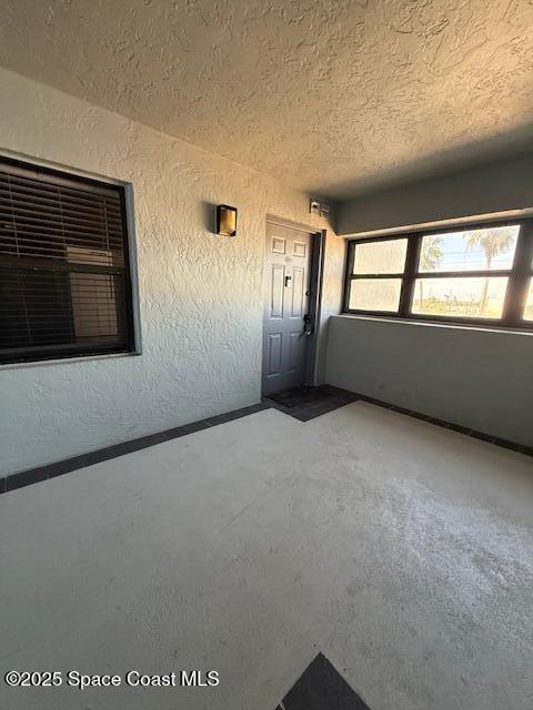 85 South Atlantic Avenue, Unit 306 Cocoa Beach, FL 32931 - Photo 4 of 41 a view of an empty room with a window
