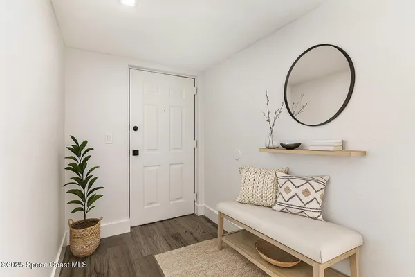 a bathroom with a toilet and a mirror