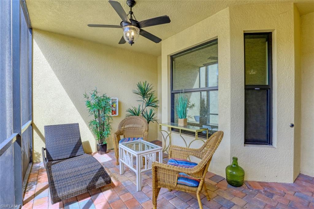 9533 Avellino Way, Unit 2916 Naples, FL 34113 - Photo 21 of 23 a living room with furniture and a window