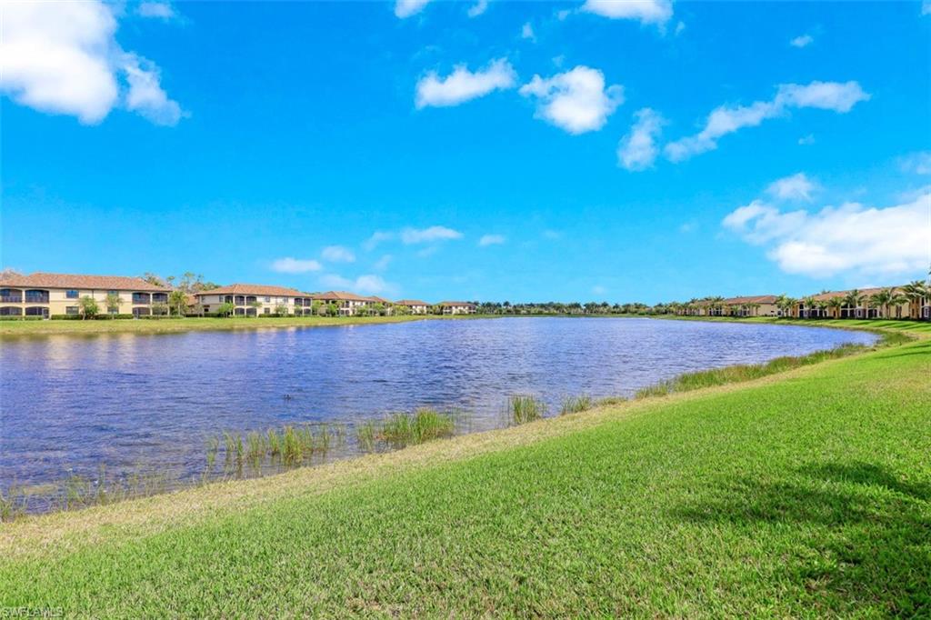 9533 Avellino Way, Unit 2916 Naples, FL 34113 - Photo 22 of 23 a view of a lake with houses in the back