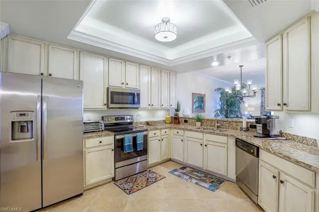 a kitchen with a sink stove and refrigerator