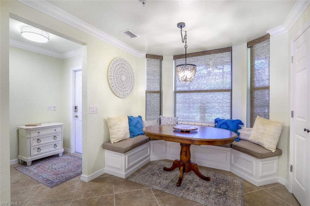 9533 Avellino Way, Unit 2916 Naples, FL 34113 - Photo 10 of 23 a living room with furniture and a window