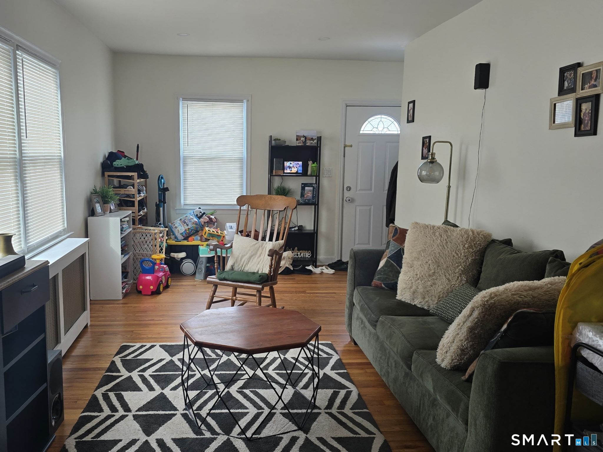 73 Rippowam Road Stamford, CT 06902 - Photo 12 of 19 a living room with furniture and a wooden floor