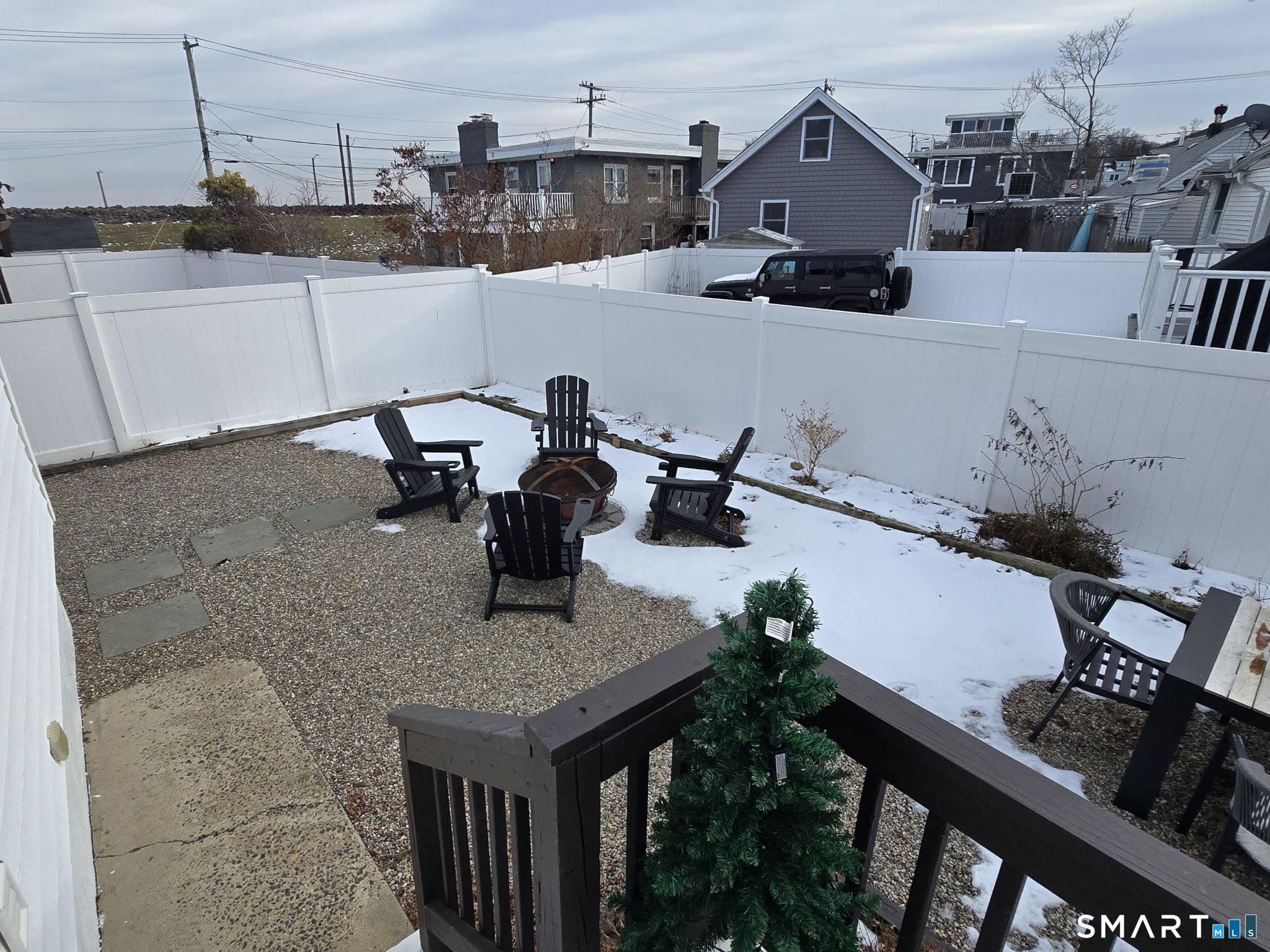 73 Rippowam Road Stamford, CT 06902 - Photo 18 of 19 a terrace of a house with outdoor seating