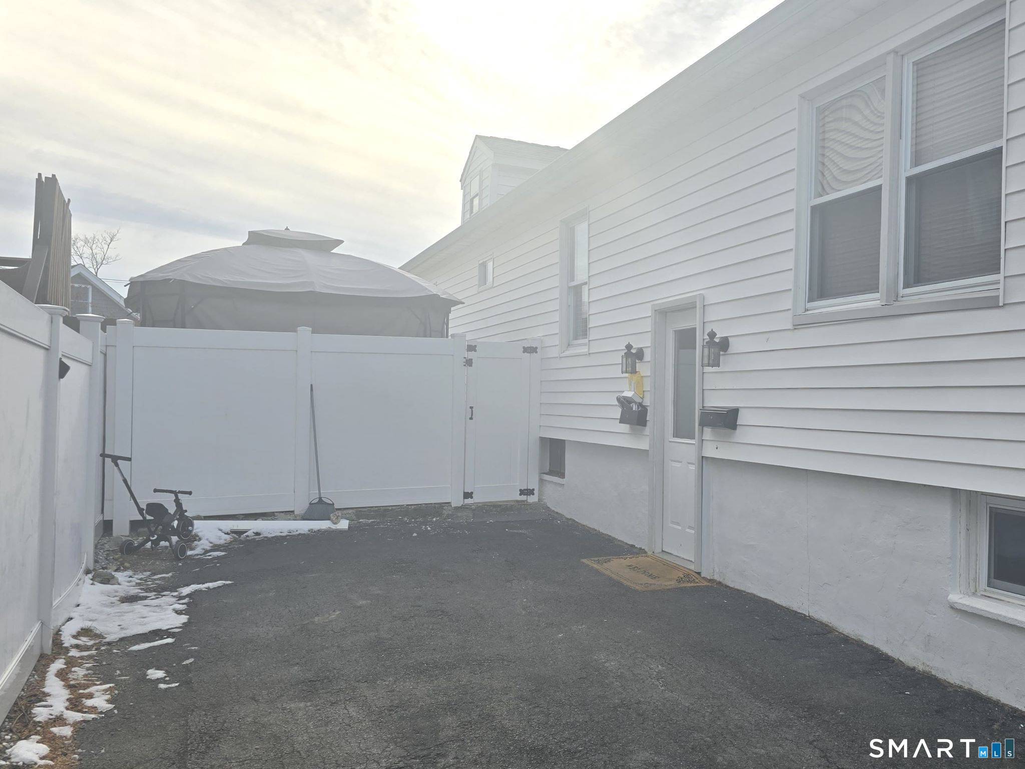 73 Rippowam Road Stamford, CT 06902 - Photo 19 of 19 a view of a house with a garage