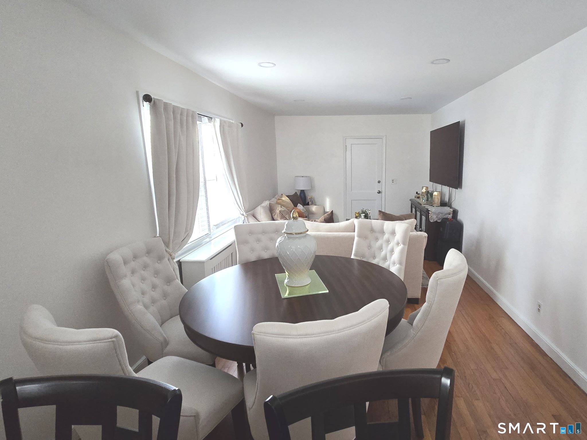 73 Rippowam Road Stamford, CT 06902 - Photo 4 of 19 a view of a dining room with furniture and wooden floor