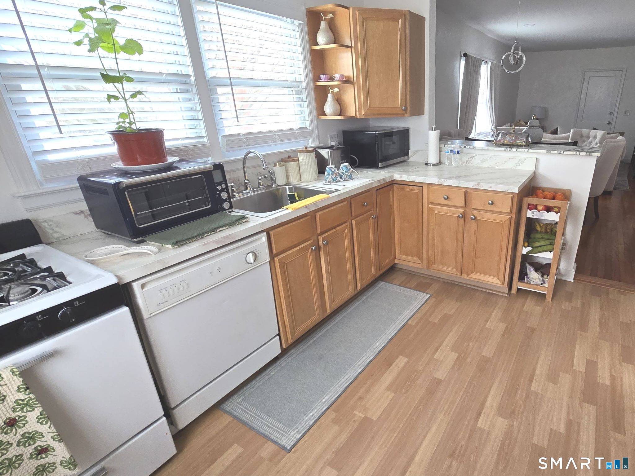 73 Rippowam Road Stamford, CT 06902 - Photo 6 of 19 a kitchen with a sink appliances and a window