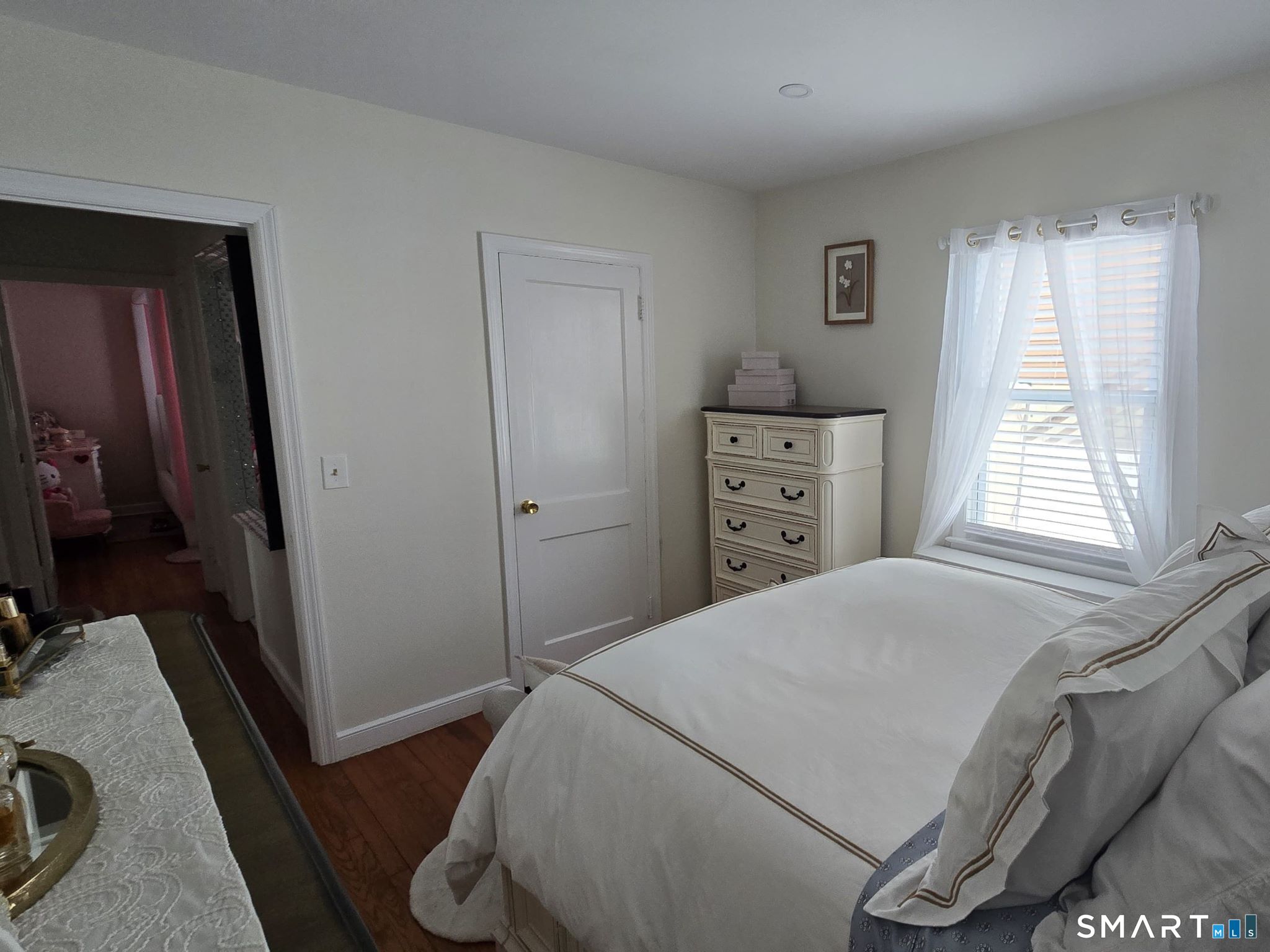 73 Rippowam Road Stamford, CT 06902 - Photo 8 of 19 a bedroom with a bed and a dresser