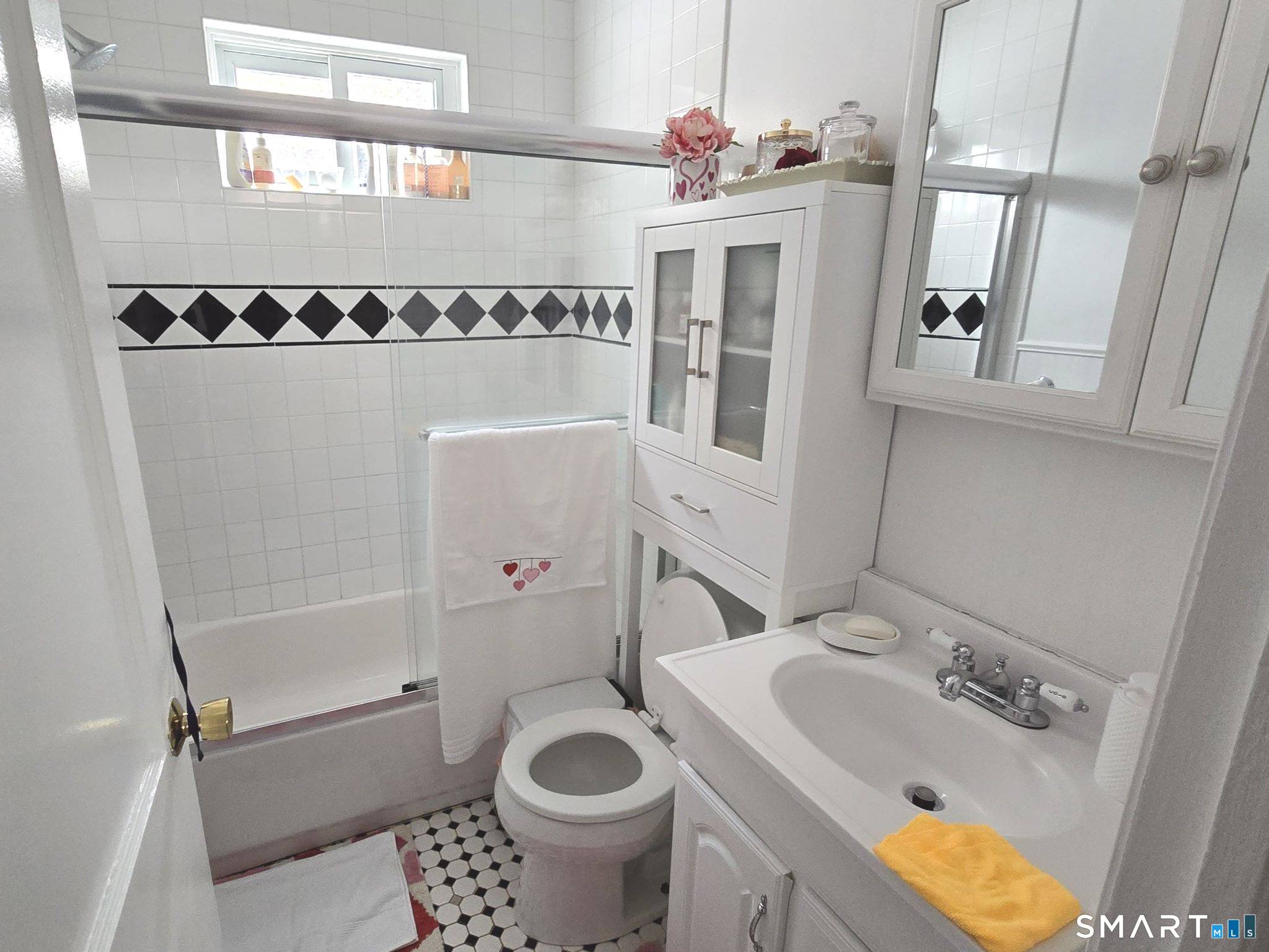 73 Rippowam Road Stamford, CT 06902 - Photo 10 of 19 a bathroom with a sink toilet and shower