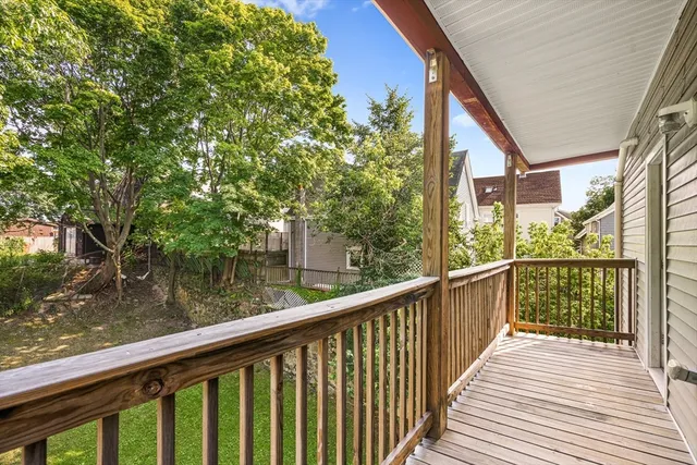 a view of a wooden deck next to a lake view