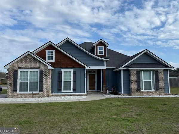 a front view of a house with a yard