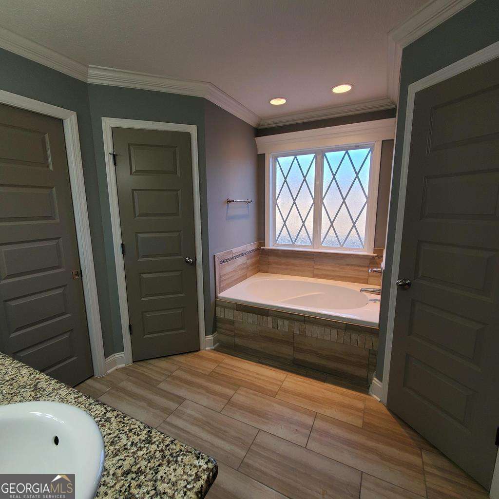 5255 Carlton Ridge Circle Hahira, GA 31632 - Photo 11 of 21 a view of bedroom with window and hardwood floor