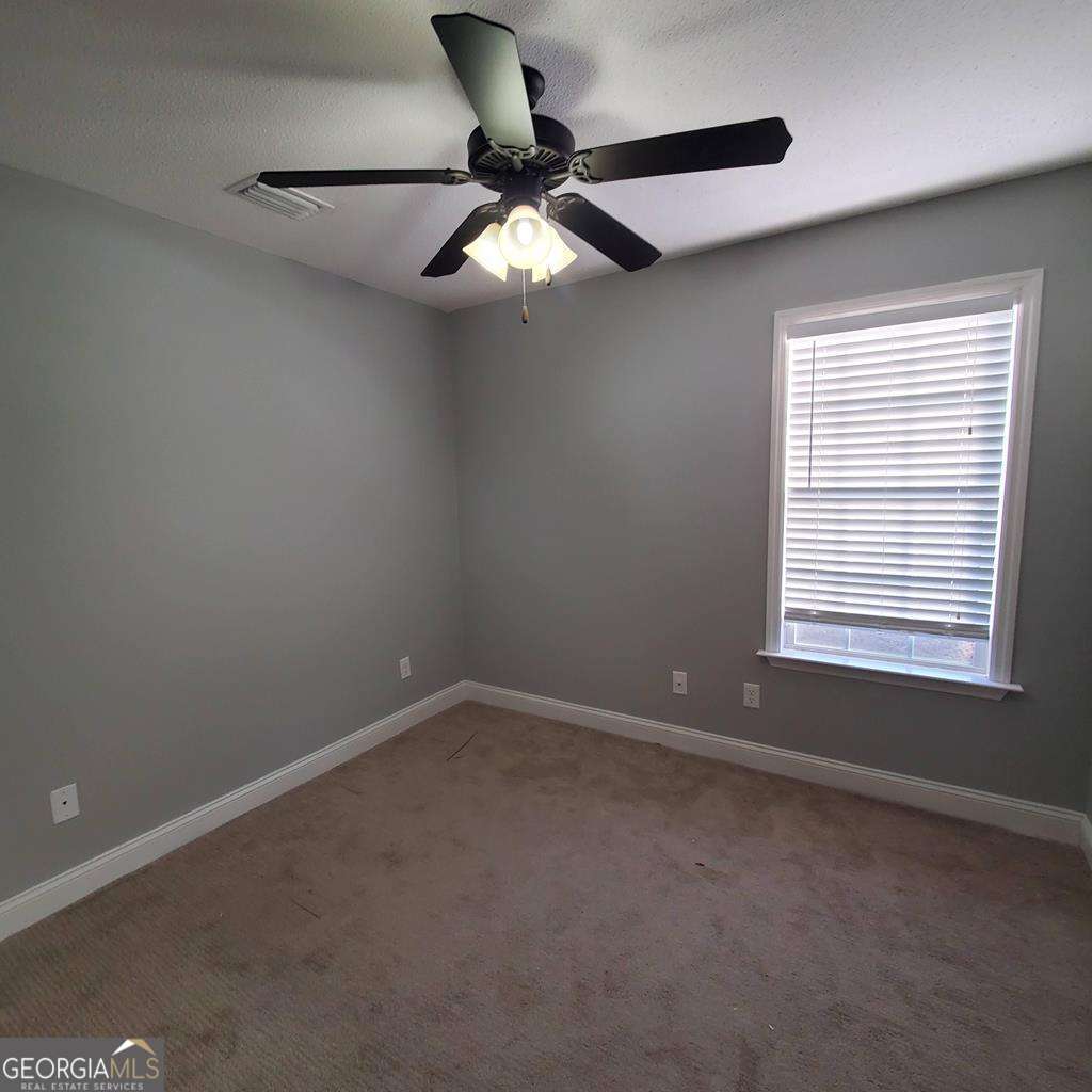 5255 Carlton Ridge Circle Hahira, GA 31632 - Photo 16 of 21 a view of an empty room with a window