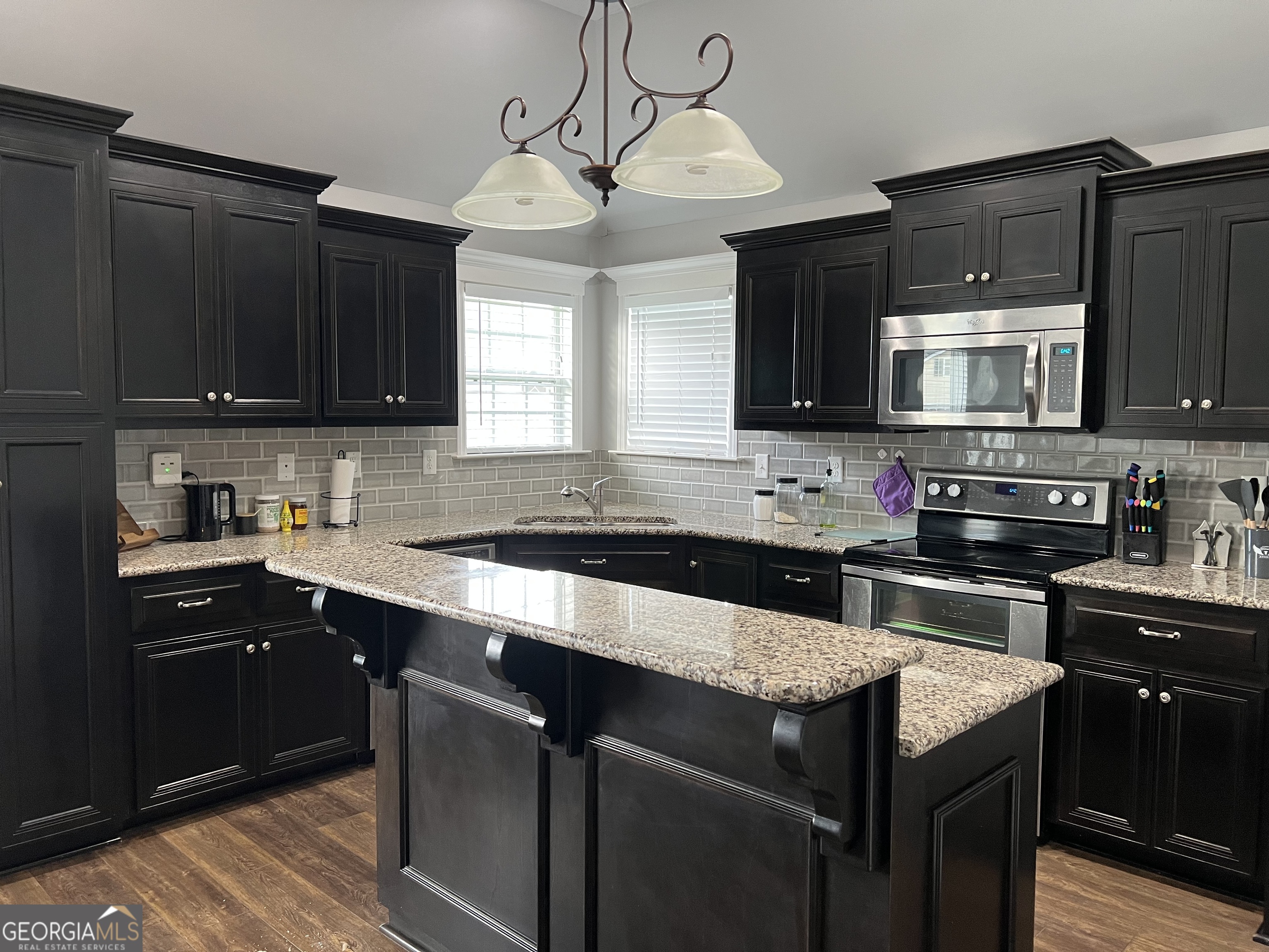 5255 Carlton Ridge Circle Hahira, GA 31632 - Photo 5 of 21 a kitchen with a sink and a stove top oven