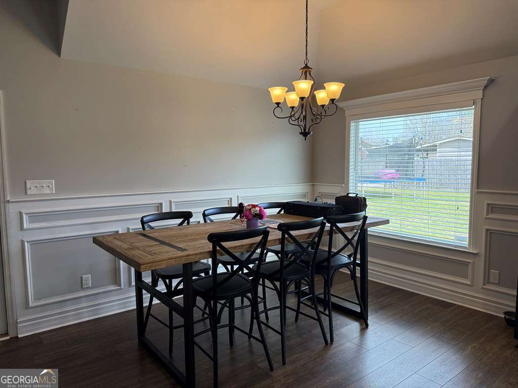 5255 Carlton Ridge Circle Hahira, GA 31632 - Photo 8 of 21 a view of a dining room with furniture wooden floor and chandelier