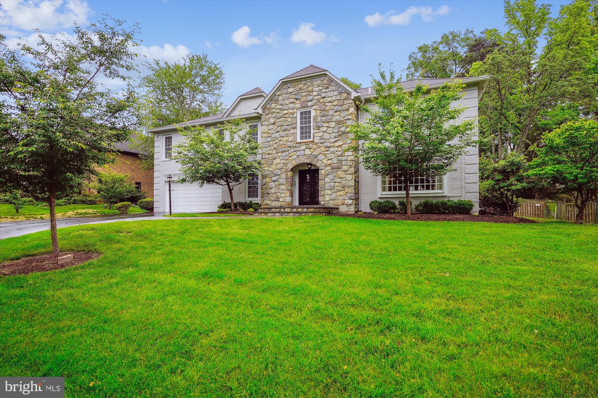9801 Hall Road Potomac, MD 20854 - Photo 2 of 79 a front view of a house with garden and tree