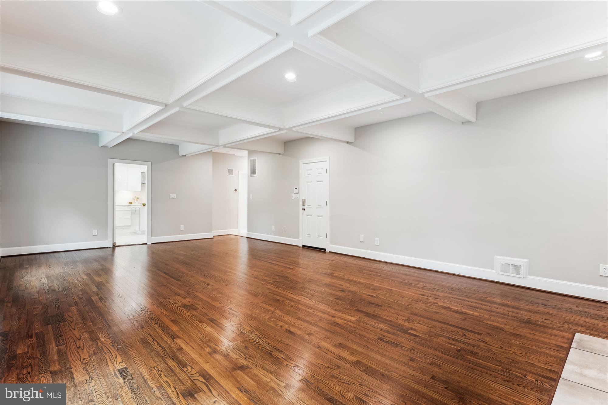 9801 Hall Road Potomac, MD 20854 - Photo 22 of 79 an empty room with wooden floor and windows