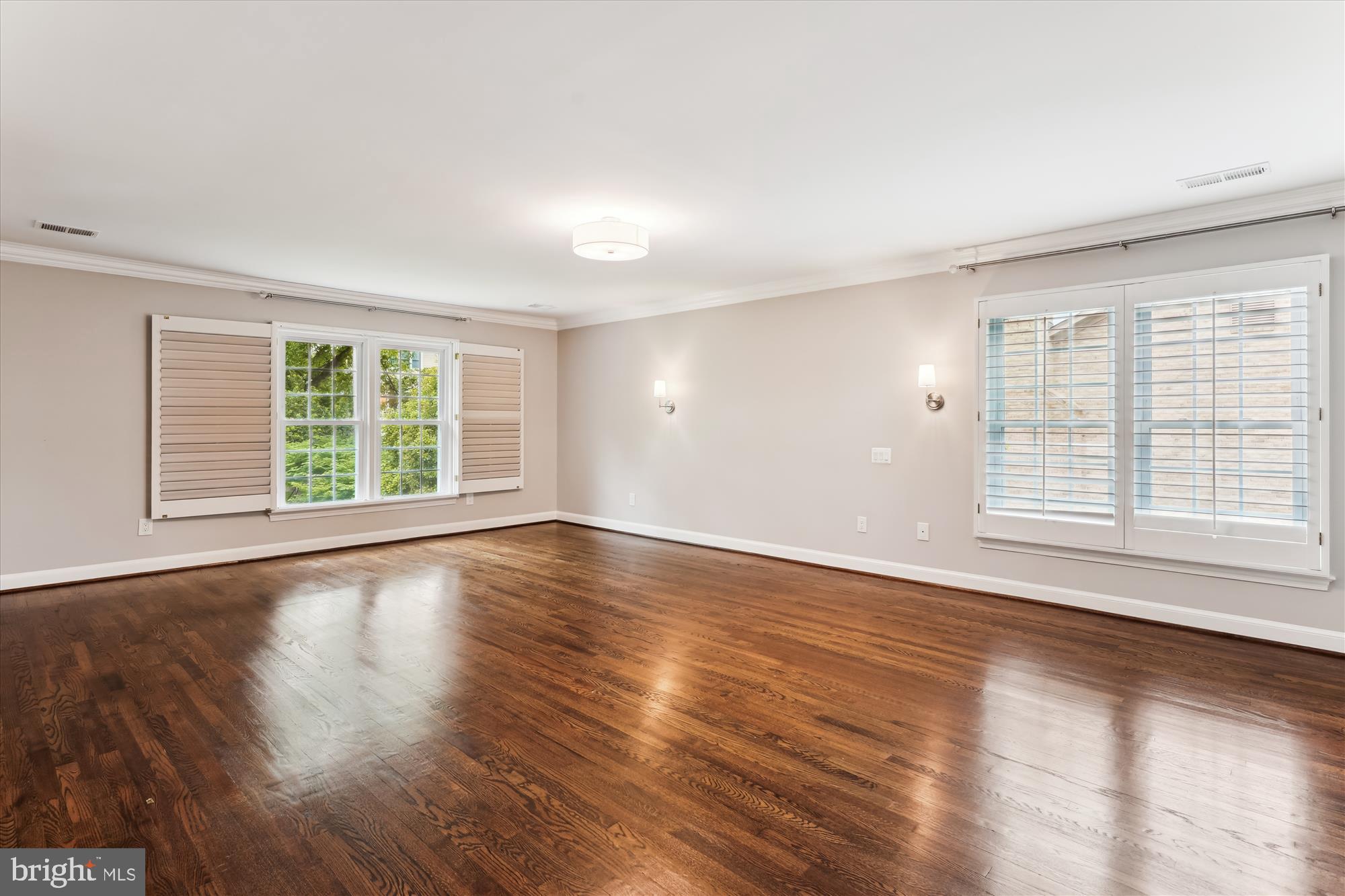 9801 Hall Road Potomac, MD 20854 - Photo 27 of 79 a view of an empty room with wooden floor and a window