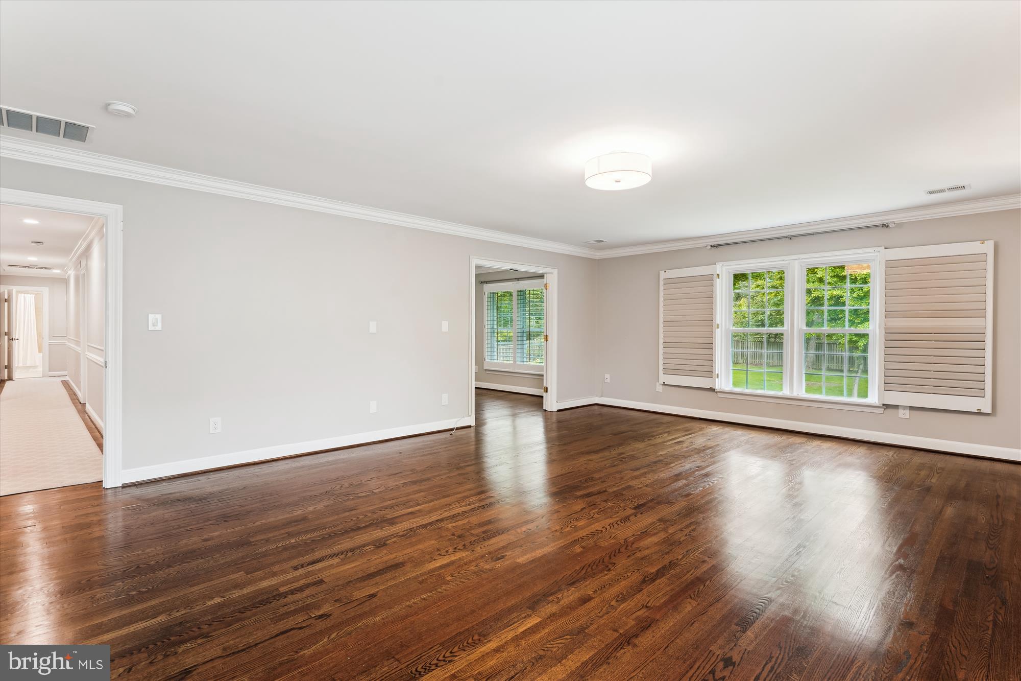 9801 Hall Road Potomac, MD 20854 - Photo 28 of 79 an empty room with wooden floor and windows