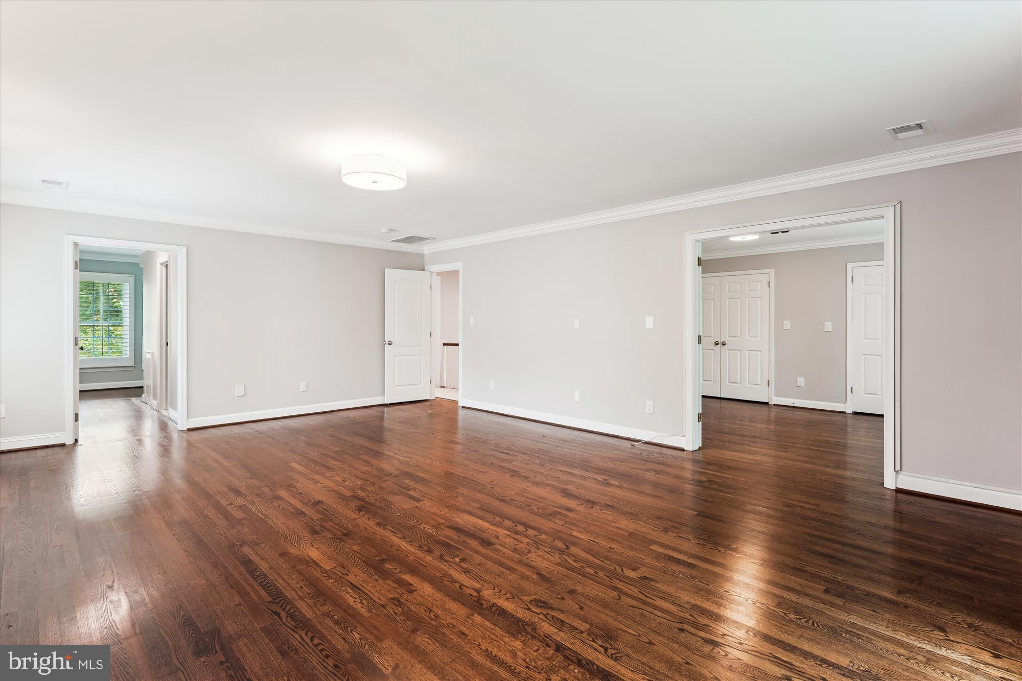 9801 Hall Road Potomac, MD 20854 - Photo 31 of 79 a view of empty room with wooden floor and windows