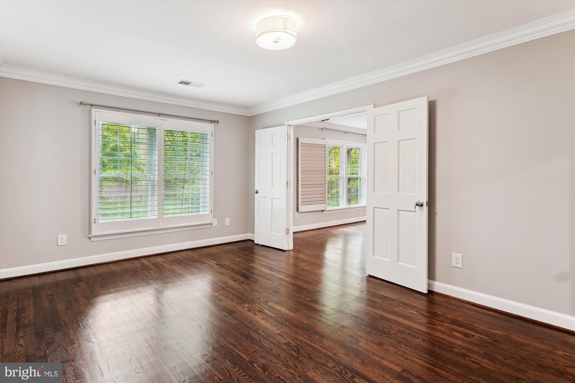 9801 Hall Road Potomac, MD 20854 - Photo 33 of 79 a view of an empty room with wooden floor and a window
