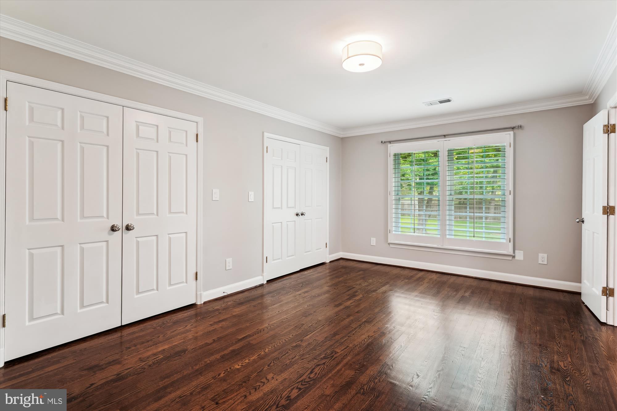 9801 Hall Road Potomac, MD 20854 - Photo 34 of 79 a view of an empty room with wooden floor and a window