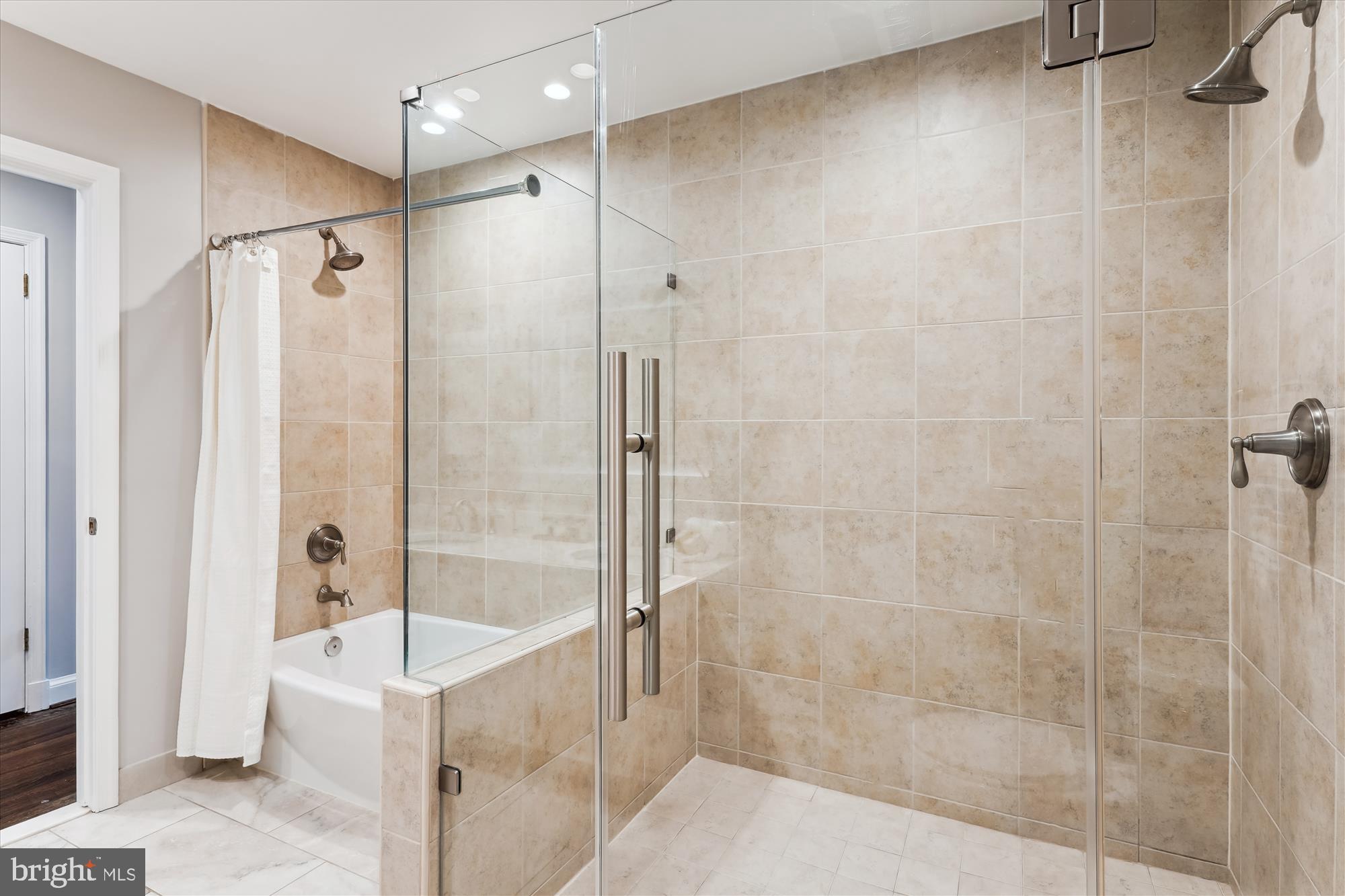 9801 Hall Road Potomac, MD 20854 - Photo 36 of 79 a bathroom with a bathtub and a shower
