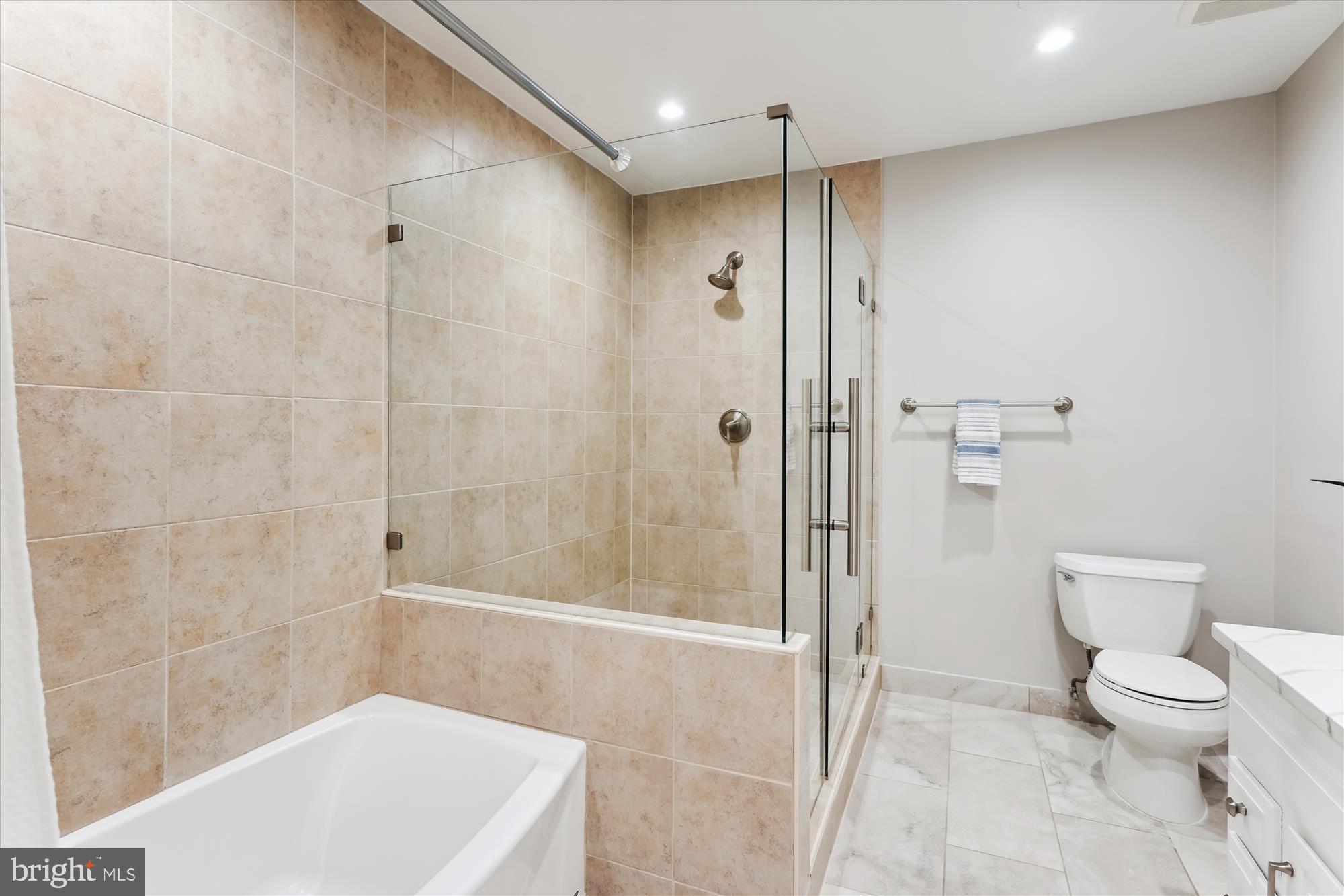 9801 Hall Road Potomac, MD 20854 - Photo 37 of 79 a bathroom with a toilet a sink and shower