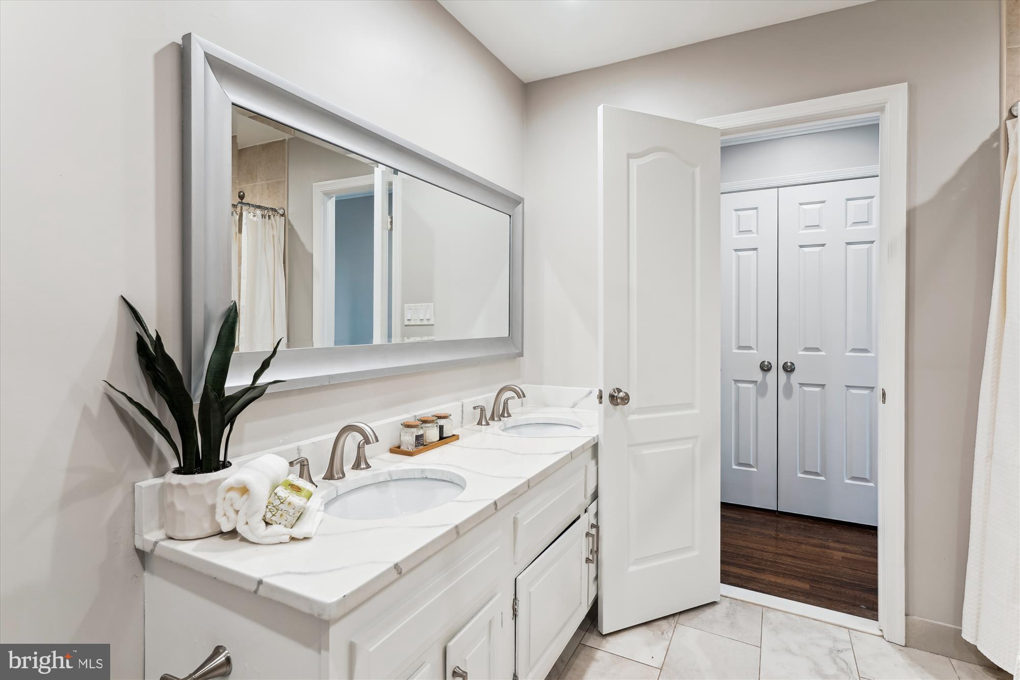 9801 Hall Road Potomac, MD 20854 - Photo 40 of 79 a bathroom with a sink a vanity and a mirror