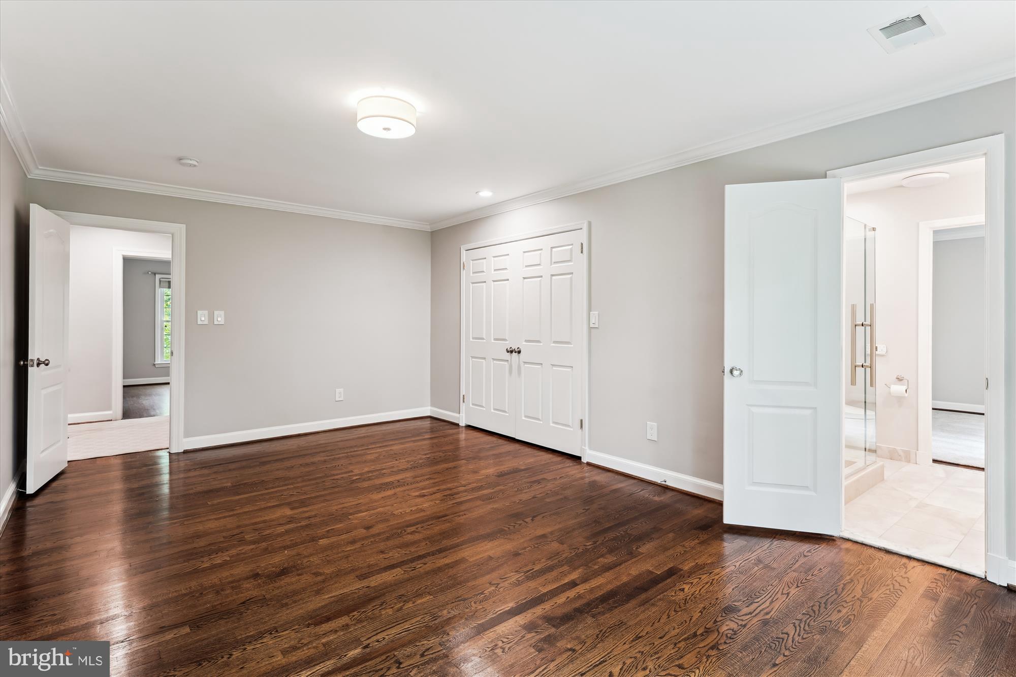 9801 Hall Road Potomac, MD 20854 - Photo 45 of 79 a view of an empty room with wooden floor and a window