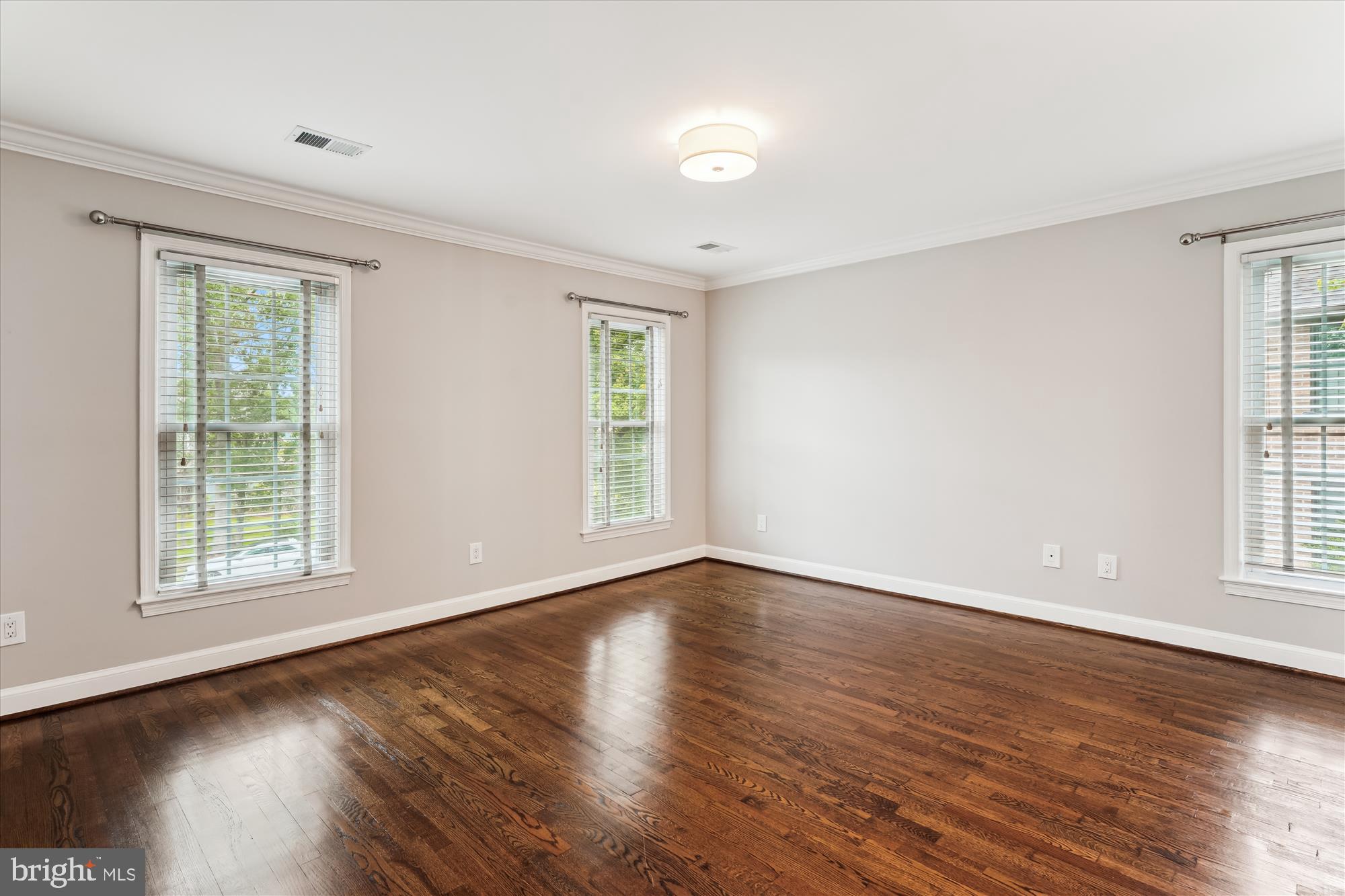 9801 Hall Road Potomac, MD 20854 - Photo 48 of 79 a view of an empty room with wooden floor and a window