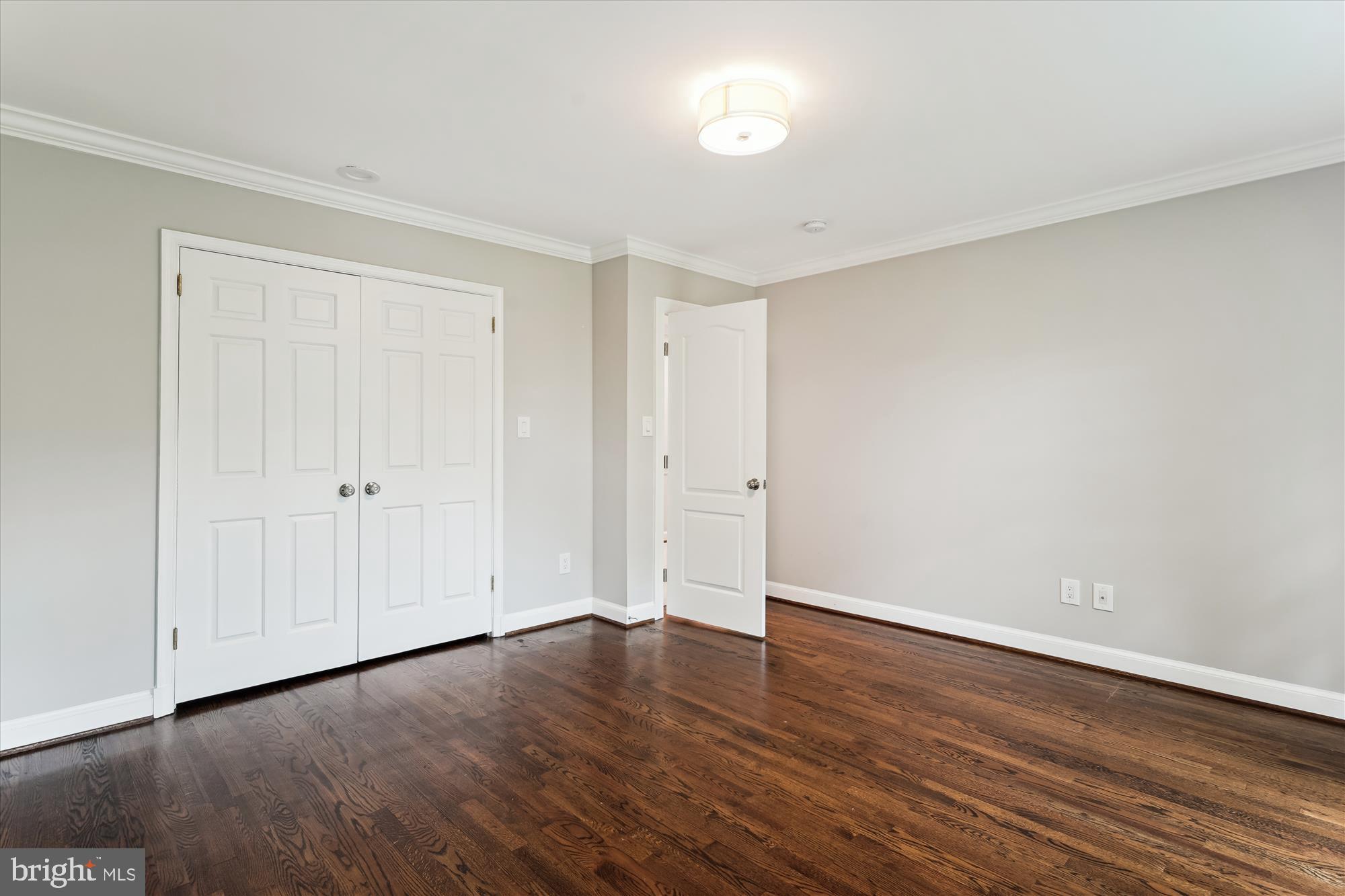 9801 Hall Road Potomac, MD 20854 - Photo 51 of 79 a view of an empty room with wooden floor