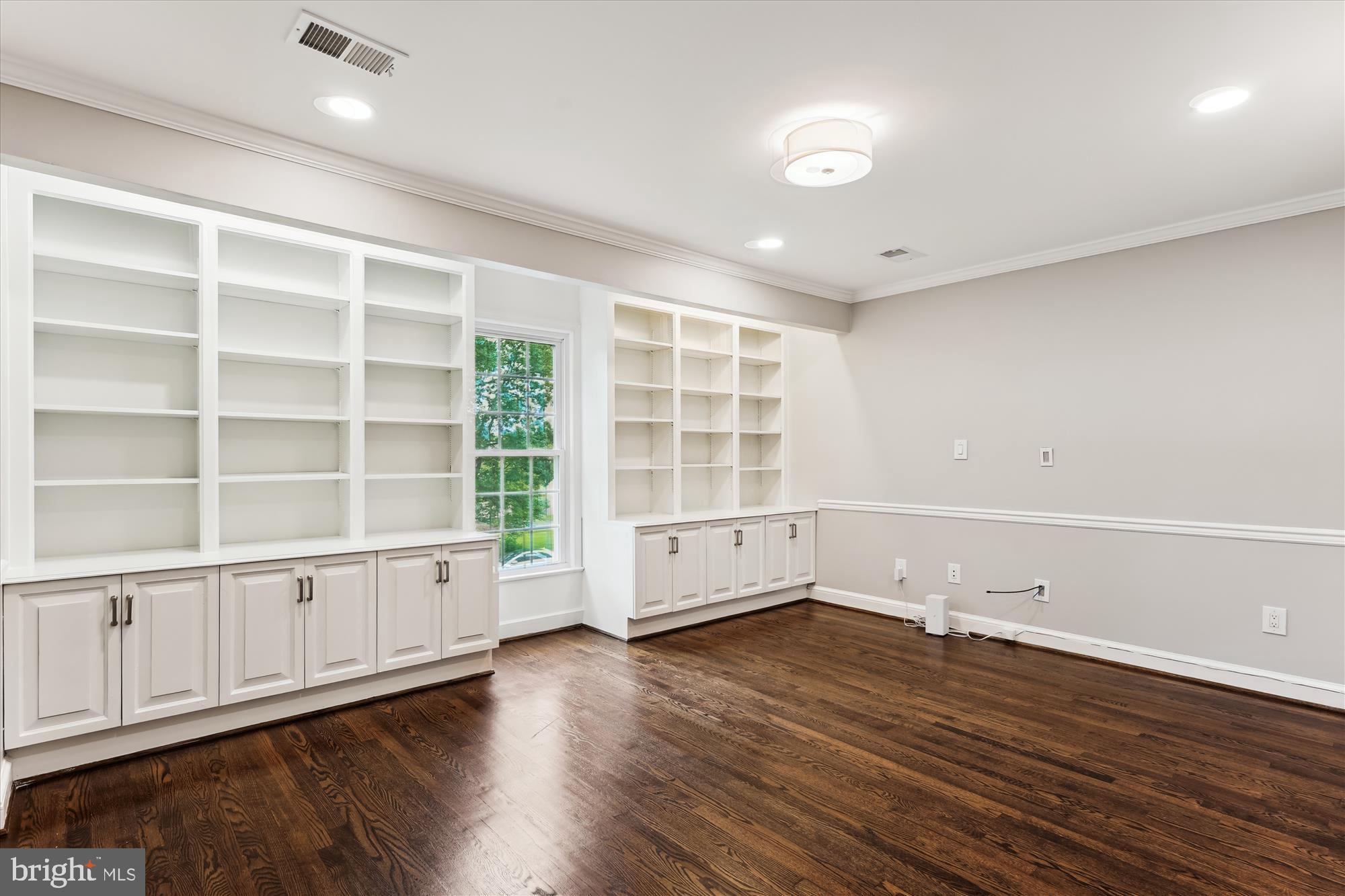9801 Hall Road Potomac, MD 20854 - Photo 52 of 79 an empty room with wooden floor and windows