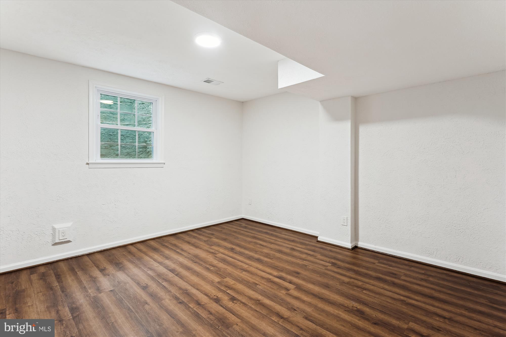 9801 Hall Road Potomac, MD 20854 - Photo 56 of 79 an empty room with wooden floor and windows
