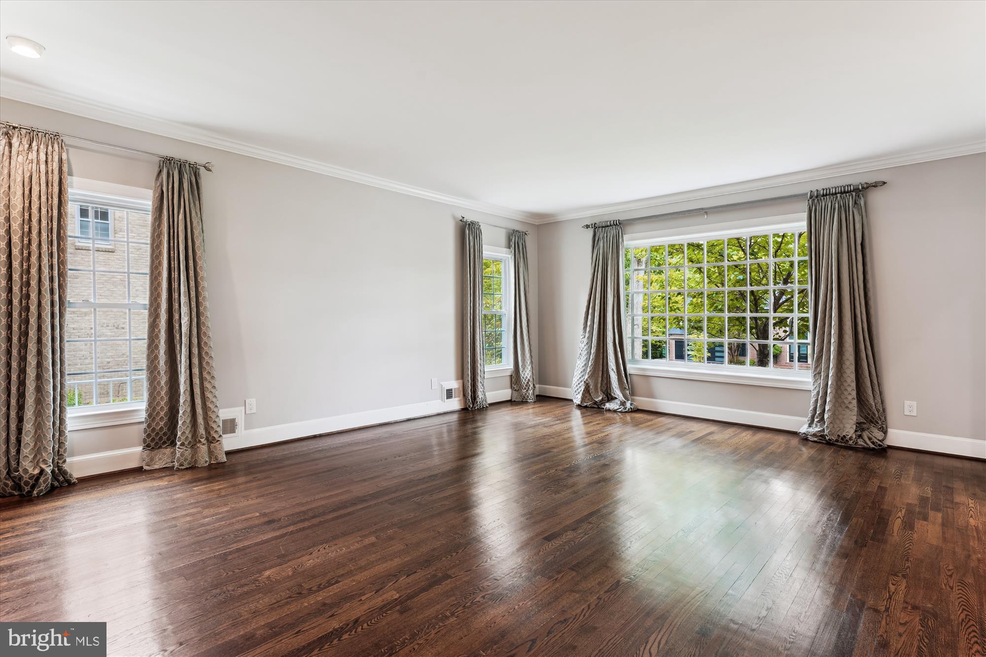 9801 Hall Road Potomac, MD 20854 - Photo 7 of 79 an empty room with wooden floor and windows