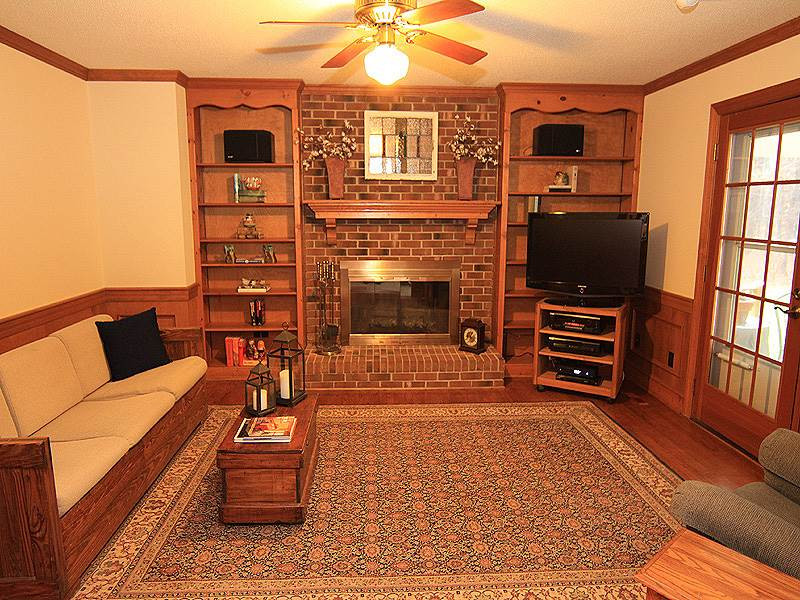 116 Hartland Court Raleigh, NC 27614 - Photo 10 of 25 Family room is just off the kitchen/breakfast area. Many will find this room a welcome retreat coming in from the backyard, deck or garage. Den/Family/Great Room