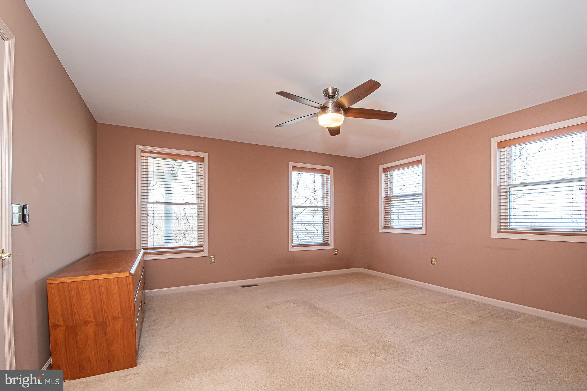 664 Brandy Road Front Royal, VA 22630 - Photo 21 of 59 Lots of windows in this main level primary bedroom