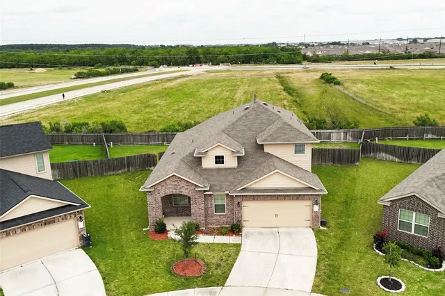 a bedroom with a bed and a night stand