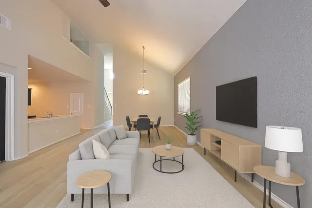 a view of a house with a yard and sitting area