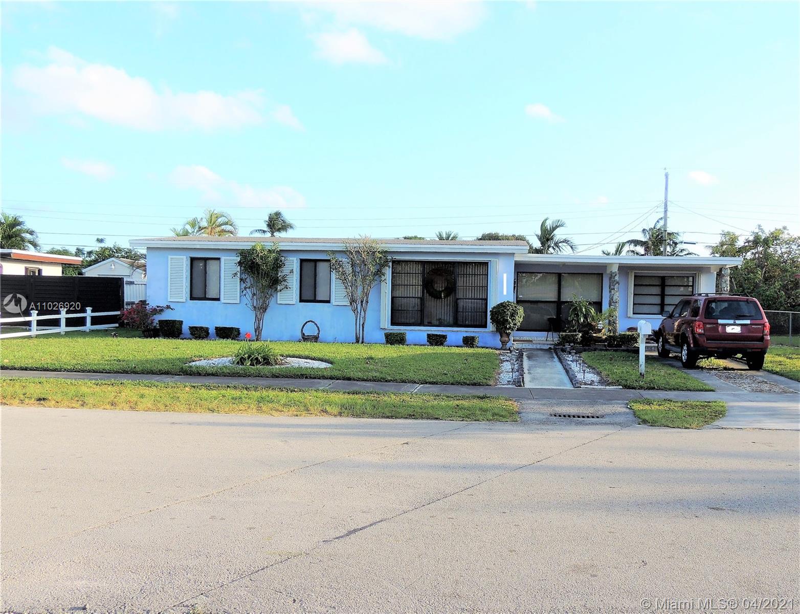 Westwood Lakes Miami, FL 33165 - Photo 1 of 29 a view of house with a big yard and potted plants